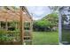 Lush garden with raised beds under pergola at 112 10Th St, St Cloud, FL 34769