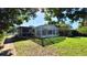 Backyard with screened pool and pergola at 112 10Th St, St Cloud, FL 34769