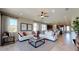 Spacious living room with two sofas, coffee table, and ceiling fan at 2011 Stetson Ct, Eagle Lake, FL 33839
