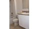 Clean bathroom with a single vanity, tub, and shower at 1823 Veterans Dr, Kissimmee, FL 34744