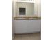 Bathroom features a double vanity and granite countertop at 1823 Veterans Dr, Kissimmee, FL 34744
