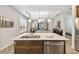 Modern kitchen with island, stainless steel appliances, and hardwood floors at 245 Panzano Ter, Poinciana, FL 34759