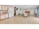 Open concept dining area with wood table and chairs, adjacent to kitchen at 4758 Wyresdale St, Orlando, FL 32808