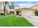 Two-story house with a two-car garage and well-maintained lawn at 4758 Wyresdale St, Orlando, FL 32808
