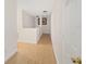 Bright hallway with light wood flooring and access to multiple rooms at 4758 Wyresdale St, Orlando, FL 32808