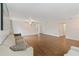 Open living room with wood-look floors and large windows at 4758 Wyresdale St, Orlando, FL 32808