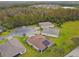 Aerial view showcasing a home's backyard and neighborhood at 795 Aviara Ln, Kissimmee, FL 34759