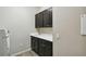 Laundry room with washer/dryer hookups and upper cabinets at 795 Aviara Ln, Kissimmee, FL 34759