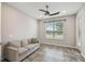 Bright living room with a sofa and large window at 795 Aviara Ln, Kissimmee, FL 34759