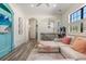 Bright game room features comfortable seating, built-in entertainment center, and natural light at 7435 Gathering Ct, Reunion, FL 34747