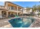 Luxury home with a large pool, spa, and patio furniture at 7435 Gathering Ct, Reunion, FL 34747