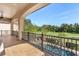 Private balcony overlooking a lush golf course and resort-style pool at 7435 Gathering Ct, Reunion, FL 34747