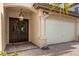 Elegant entryway with double doors and attached garage at 7435 Gathering Ct, Reunion, FL 34747