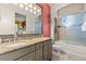 Double vanity bathroom with granite countertop and large shower at 7435 Gathering Ct, Reunion, FL 34747