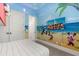 Themed bedroom with fun decor, comfortable bed, and plenty of light at 7435 Gathering Ct, Reunion, FL 34747