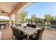 Relaxing patio featuring a dining table and chairs, overlooking the pool at 7435 Gathering Ct, Reunion, FL 34747