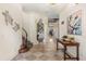 Bright and spacious entryway with a staircase and checkerboard floor at 7435 Gathering Ct, Reunion, FL 34747