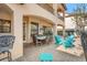 Covered patio with outdoor dining furniture, adjacent to the pool area at 7435 Gathering Ct, Reunion, FL 34747