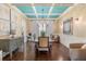 Elegant dining room with hardwood floors and tray ceiling at 7435 Gathering Ct, Reunion, FL 34747