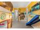 ' bedroom with a playful Moana-themed mural and a slide at 7435 Gathering Ct, Reunion, FL 34747