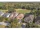 Luxury homes with tile roofs situated on a golf course at 7435 Gathering Ct, Reunion, FL 34747