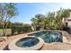 Relaxing spa and refreshing pool with a brick patio and lush landscaping at 7435 Gathering Ct, Reunion, FL 34747