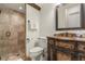 Elegant bathroom with a glass shower and ornate vanity at 7435 Gathering Ct, Reunion, FL 34747