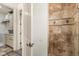 Bathroom with a large walk-in shower and tile flooring at 7435 Gathering Ct, Reunion, FL 34747