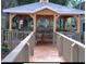 Community gazebo with a picnic table and walkway at 2440 Summerfield Way, Kissimmee, FL 34741