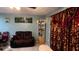 Living room featuring a brown recliner and decorative accents at 2440 Summerfield Way, Kissimmee, FL 34741