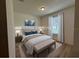 Comfortable bedroom with neutral color palette and bench at foot of bed at 3960 Steer Beach Pl, Kissimmee, FL 34746