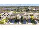 Aerial view of townhouses with garages and lush landscaping at 9824 Red Eagle Dr, Orlando, FL 32825