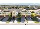 Aerial view of townhouses with garages and palm trees at 9824 Red Eagle Dr, Orlando, FL 32825