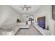 Open concept living room with beige sectional and view of kitchen at 9824 Red Eagle Dr, Orlando, FL 32825