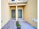 View of two townhome entryways with brick pavers at 9824 Red Eagle Dr, Orlando, FL 32825
