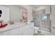 Bathroom with double sinks, shower, and toilet at 9824 Red Eagle Dr, Orlando, FL 32825