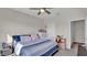 Bright bedroom with a queen bed and ceiling fan at 9824 Red Eagle Dr, Orlando, FL 32825