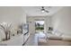 Living room with beige sofa and sliding glass doors to patio at 9824 Red Eagle Dr, Orlando, FL 32825