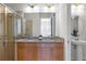 Double vanity bathroom with granite countertop and a shower at 434 Captiva Dr, Davenport, FL 33896