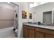 ' bathroom with double vanity, granite countertops, and a tub shower combo at 434 Captiva Dr, Davenport, FL 33896