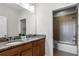 Bathroom with double vanity and granite countertop at 434 Captiva Dr, Davenport, FL 33896