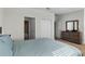 Bedroom with queen bed, dresser, and ensuite bathroom at 434 Captiva Dr, Davenport, FL 33896