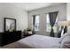 Bedroom with a queen bed and plenty of natural light at 434 Captiva Dr, Davenport, FL 33896
