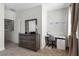 Bedroom with dresser, desk, and mirror at 434 Captiva Dr, Davenport, FL 33896