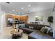 Open living room with a sectional sofa and a coffee table at 434 Captiva Dr, Davenport, FL 33896