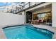 Private pool with covered patio and comfortable seating area at 434 Captiva Dr, Davenport, FL 33896