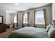 Bedroom with queen bed, dresser, and home office space at 434 Captiva Dr, Davenport, FL 33896