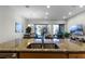 Granite countertop kitchen with stainless steel sink and view to the backyard pool at 434 Captiva Dr, Davenport, FL 33896