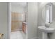 Bathroom with shower, vanity, and a separate toilet area at 434 Captiva Dr, Davenport, FL 33896