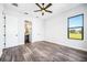 Light and airy bedroom with en-suite bathroom and large window at 224 Valencia Ridge Dr, Auburndale, FL 33823